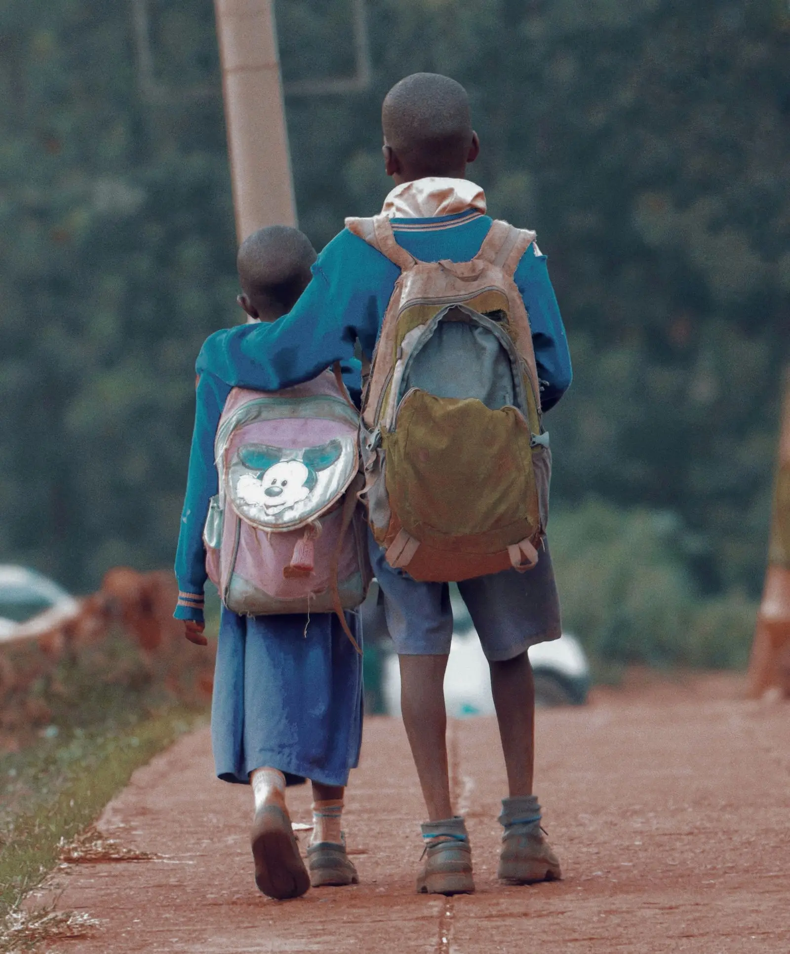 Learners walking home along a rural road